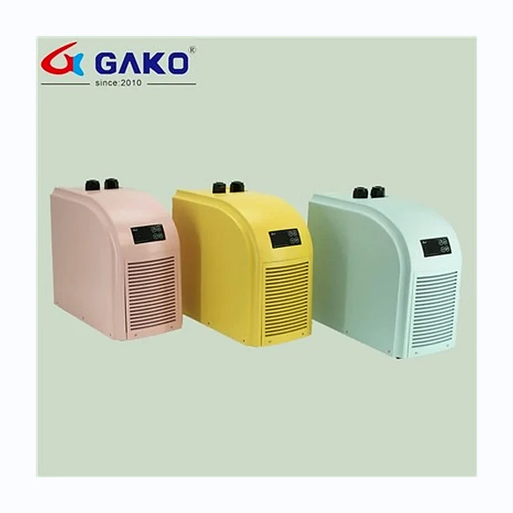 Three compact aquarium air pumps in pink, yellow and pale blue